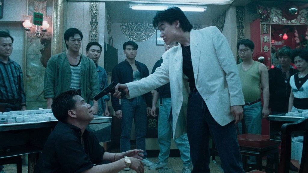 Triad member pointing a gun