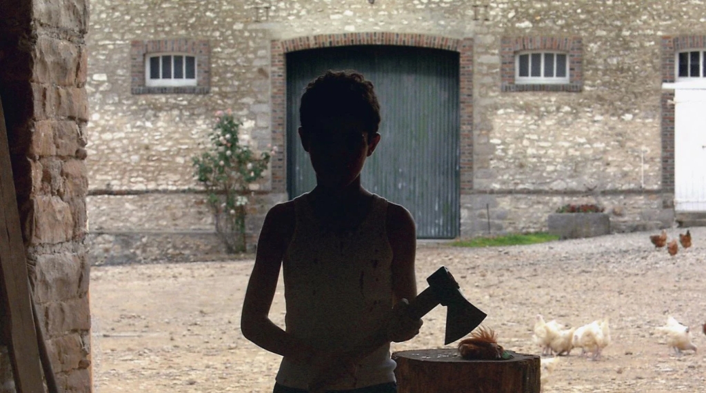 Shadowed boy in Cache (2005)