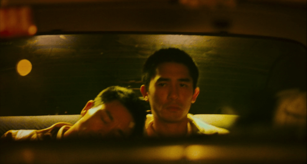 Two men back of a cab in Happy Together