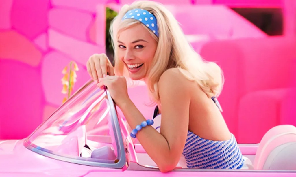 Margot Robbie as Barbie in a car