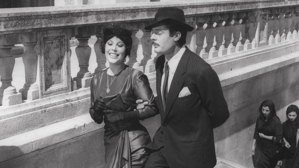 Marcello walking up stairs in Divorce Italian Style