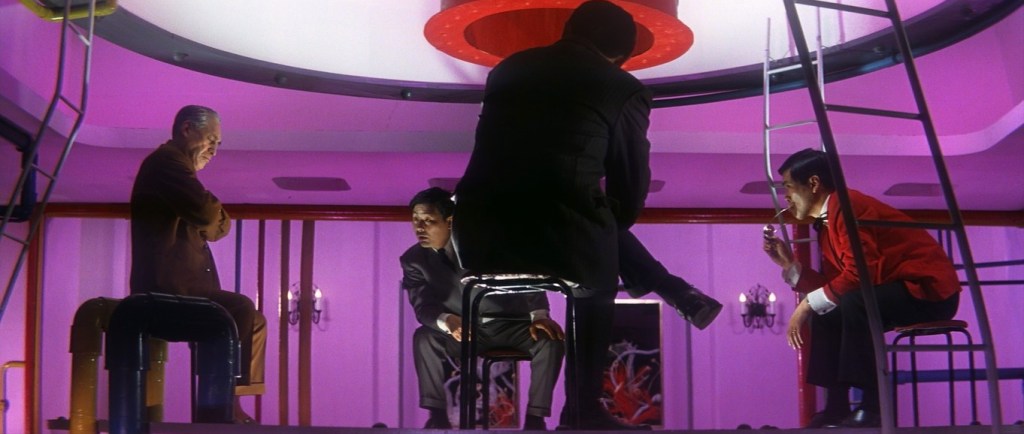 Four yakuza in a purple room